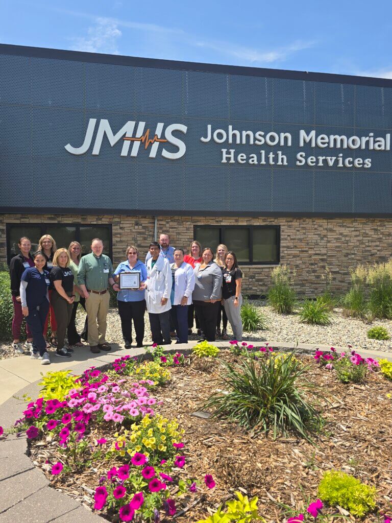 CALS Executive Director Ann Gihl presents the CALS Hospital Award to Johnson Memorial Hospital (Dawson) staff and leadership.