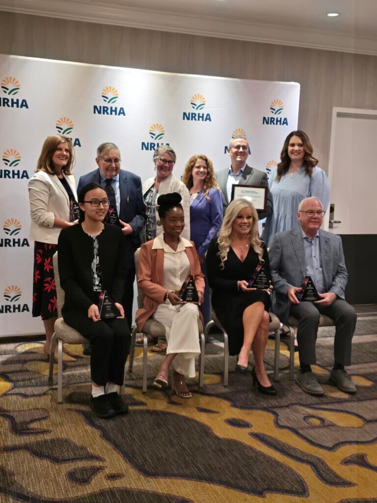 CALS co-founder Dr. Darrell Carter receiving NRHA Outstanding Educator award, pictured with 9 other NRHA award recipients.